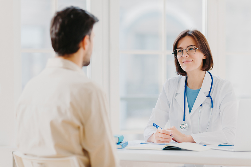 doctor-and-patient-discuss-something-sit-at-table